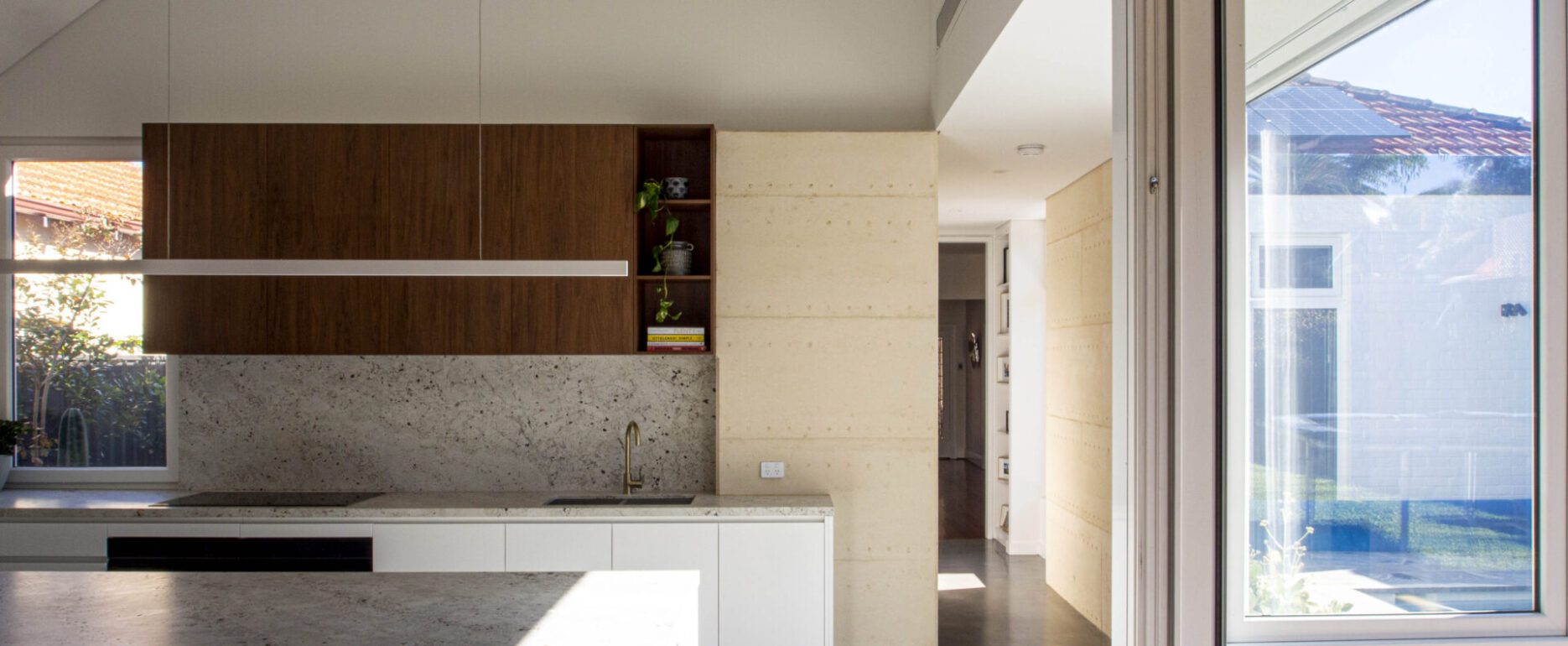 Martin Residence-Wembley-Superseed Architecture-010-Rammed earth kitchen concrete floor