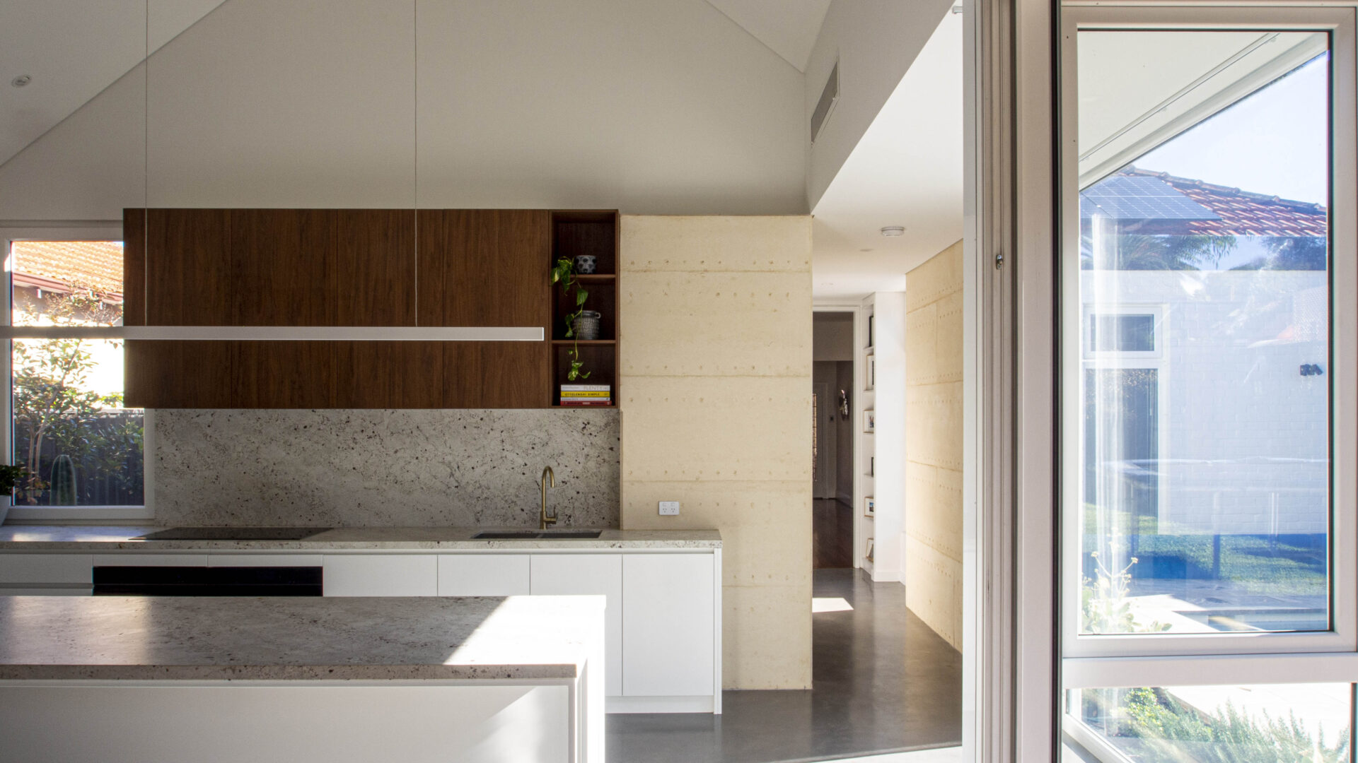 Martin Residence-Wembley-Superseed Architecture-010-Rammed earth kitchen concrete floor